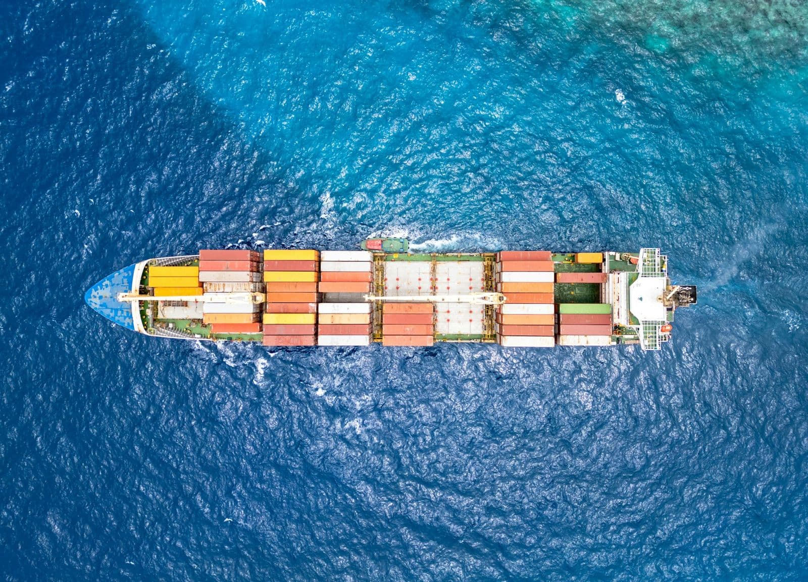 Container ship on the open ocean, seen from above